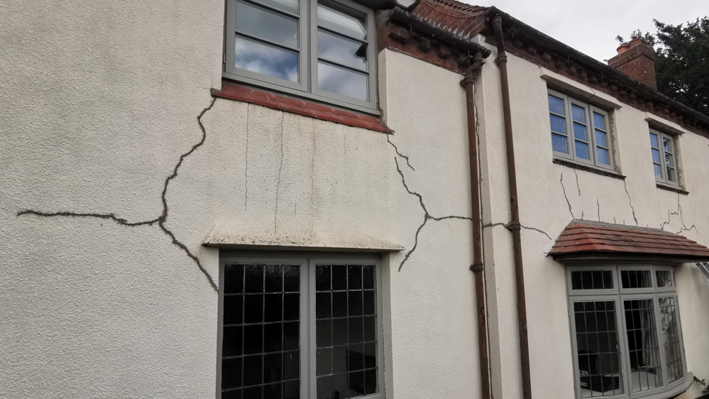 Cracked exterior walls that need to be repaired